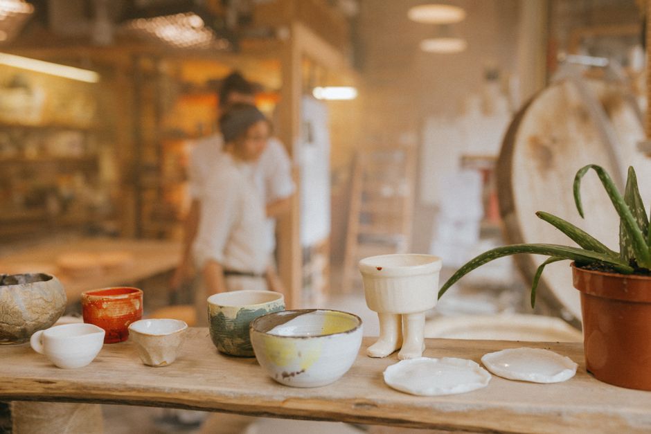 Handcrafted pottery displayed in a cozy ceramics workshop with artistic flair.